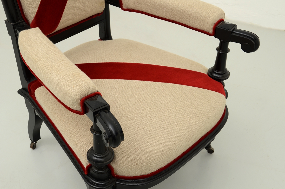 Beautiful 1880's Italian ebonized armchair with linen and velvet upholstery.