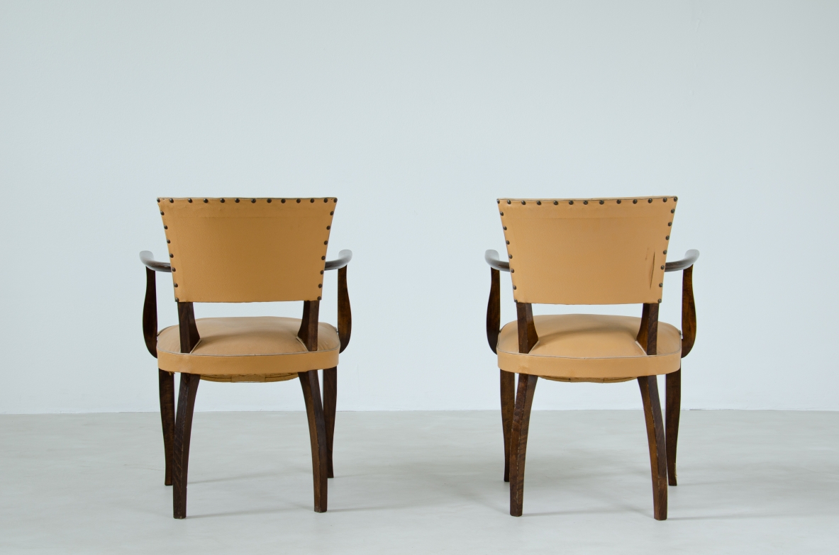 Pair of Art Deco chairs with armrests. France, 1940's.