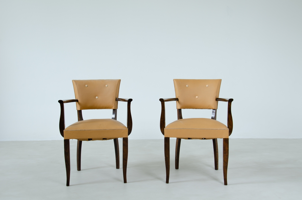 Pair of Art Deco chairs with armrests. France, 1940's.