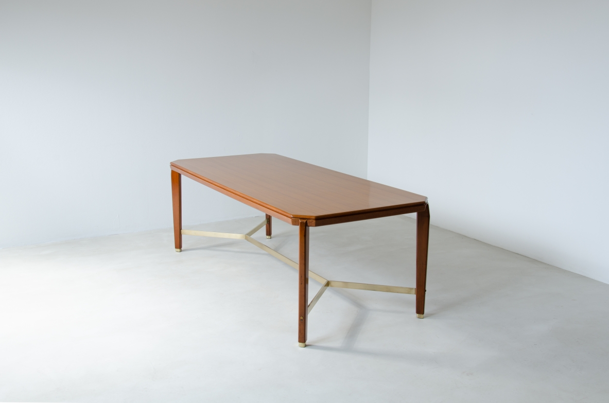 Gio Ponti (1891-1979)  Table in blond walnut with brass cross.  Designed and produced for the BNL offices in Milan in 1956.