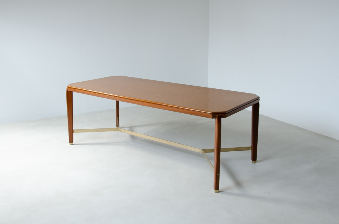 Gio Ponti (1891-1979)  Table in blond walnut with brass cross.  Designed and produced for the BNL offices in Milan in 1956.