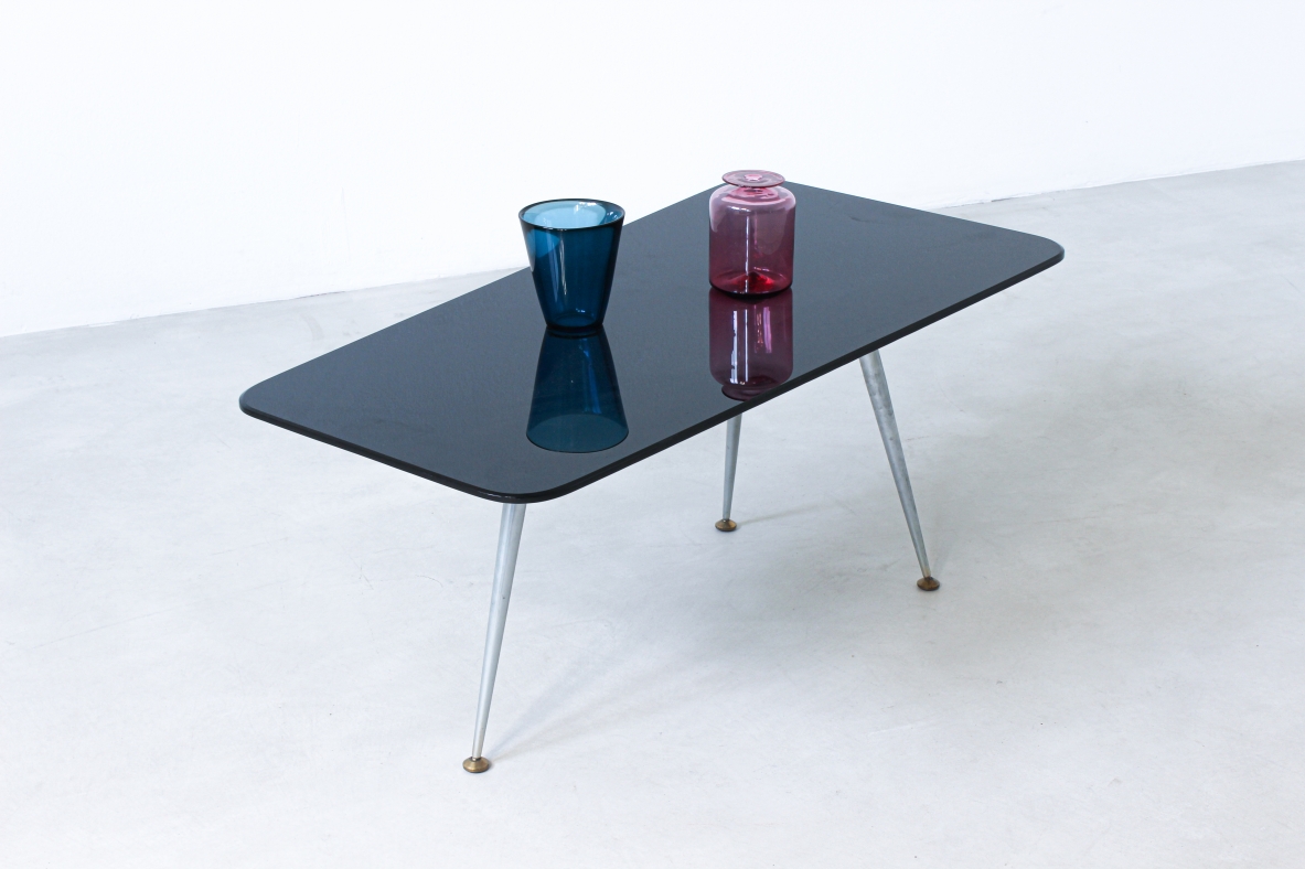 Coffee table with opaline glass top and aluminum legs with brass ends.