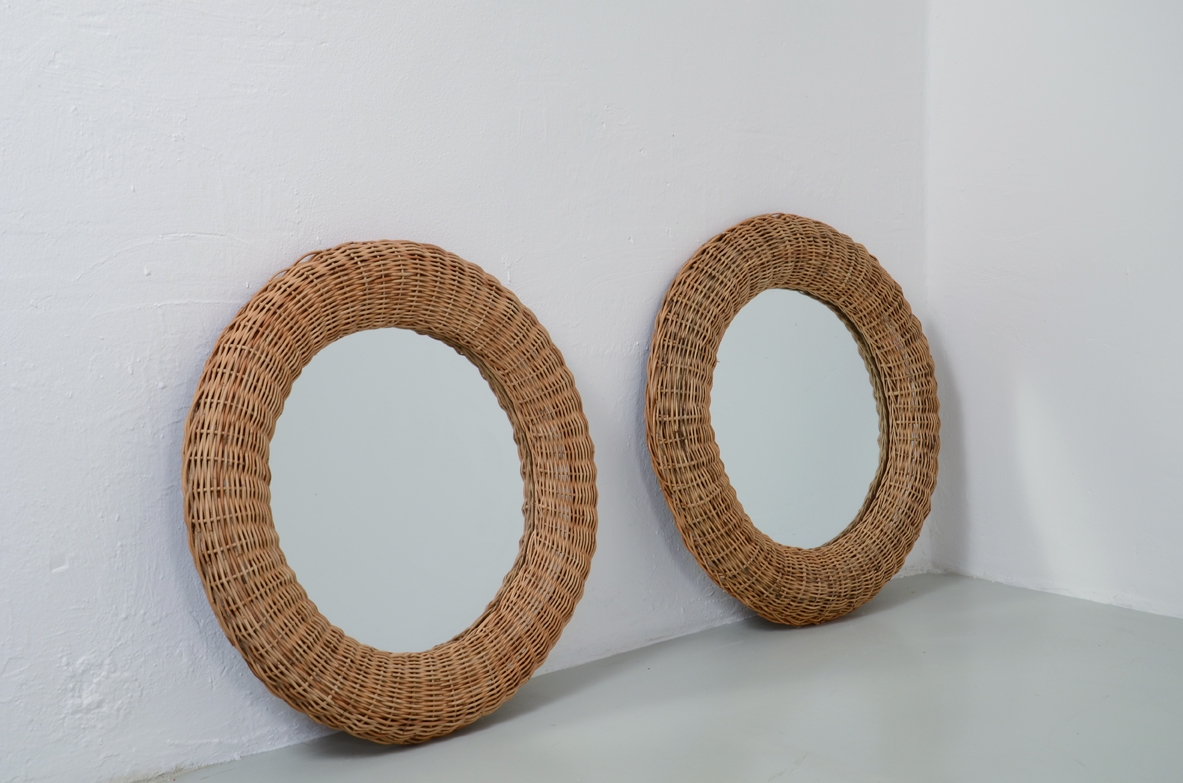 Pair of Italian 1960's round mirrors in rattan,