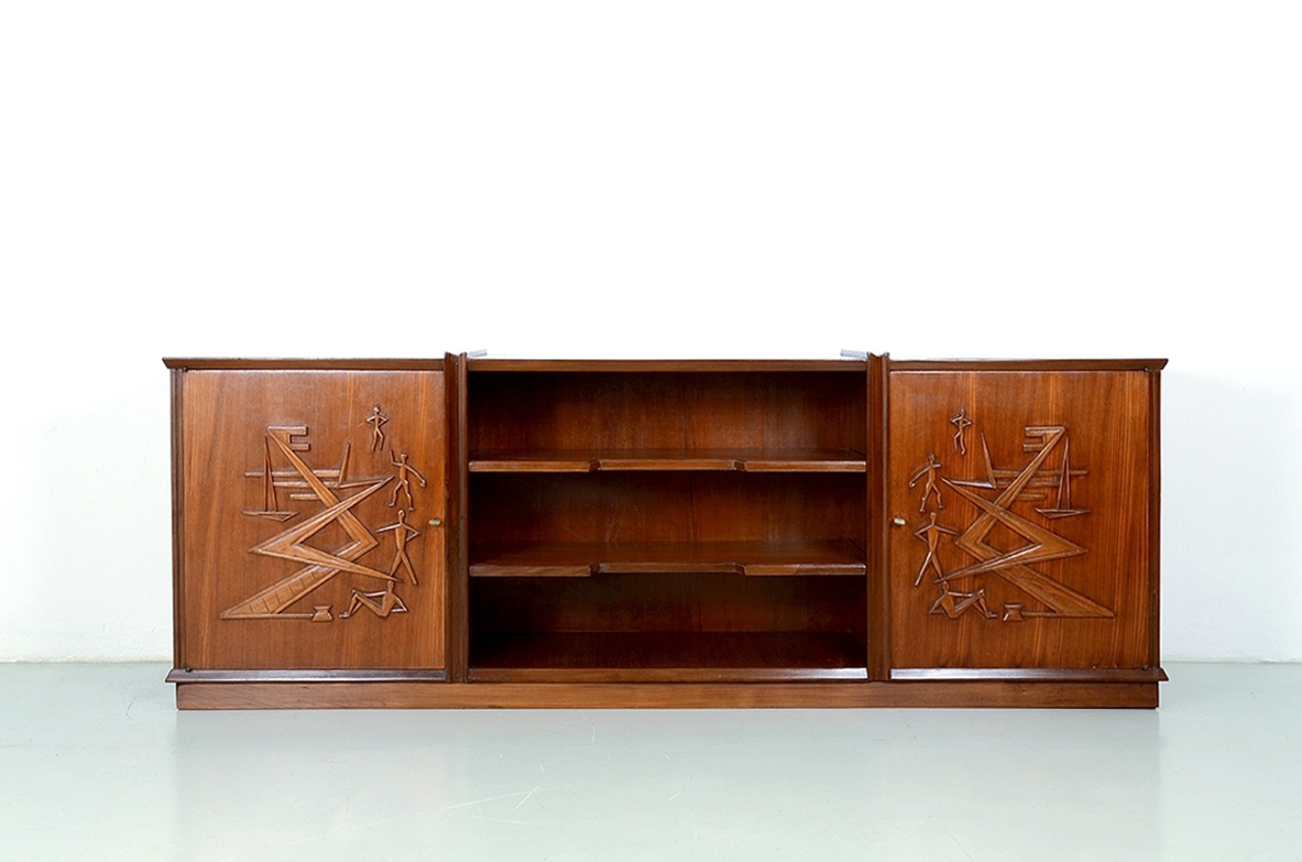 Unique sideboard in light mahogany with hand carved nice drawings on the two doors, Italy 1940's.