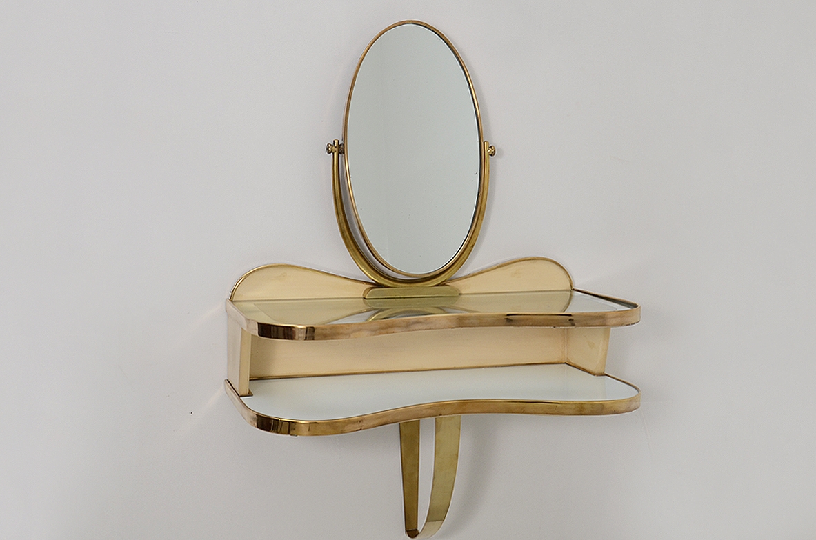 Gio Ponti, rare hanging console table in lacquered wood and brass with two shelves, one in mirrored glass and one in white opaline. Adjustable oval mirror on top. Provenience Cellina/Bormioli private collection. Gio Ponti Archive ref. Nr 16089.