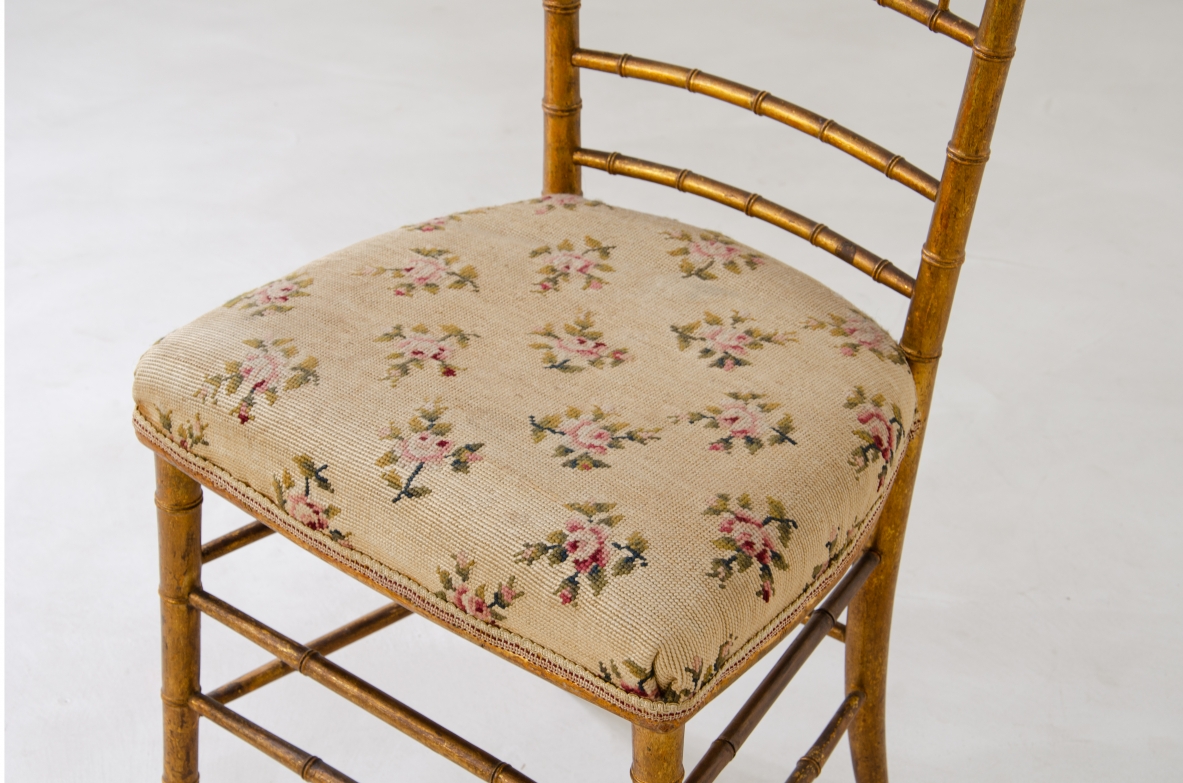 Pair of chairs in turned and gilded wood with upholstered seat with original embroidered fabric.  Italy, early XX Century.