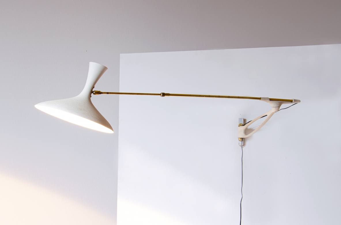 Wall lamp with adjustable arm and extendable stick.  Painted metal and brass, France 1950s.