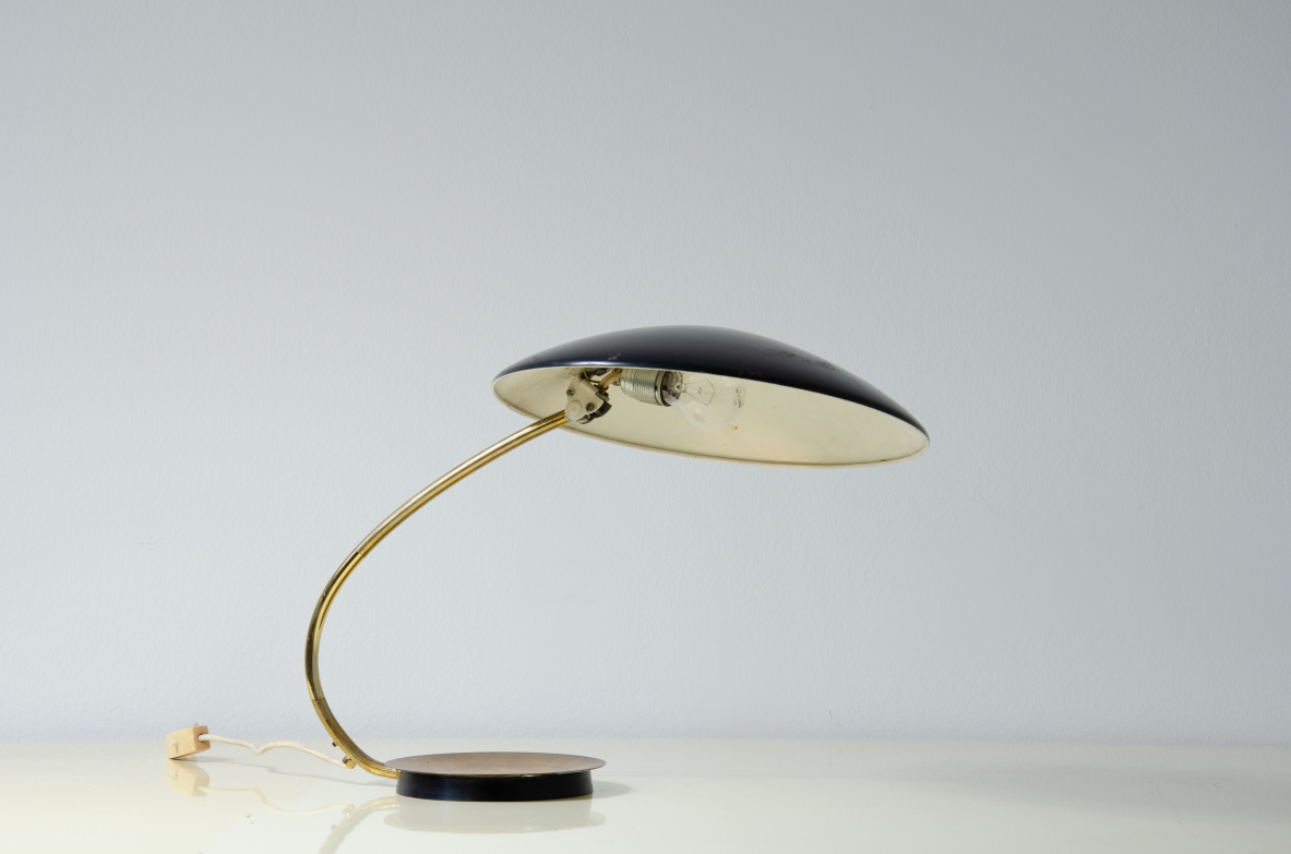 Table lamp with lacquered metal shade and brass stem.  Italy, 1950s. 