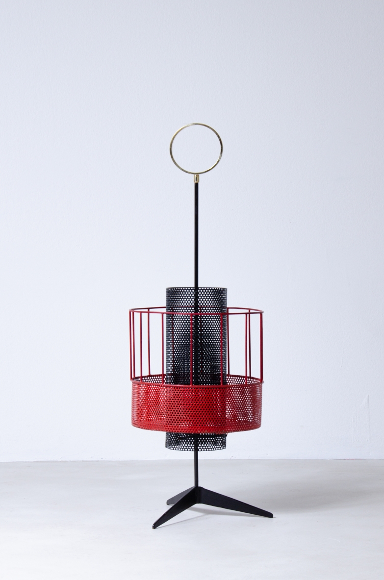 Mathieu Matègot, perforated and colored metal magazine rack or bottle holder with enamelled iron handle and foot.  French 1950s manufacture.