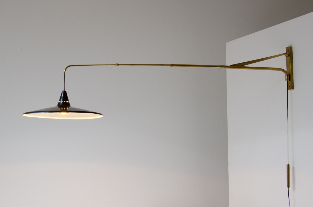 Extensible lamp with with brass stem and black painted metal shade.  Italian manufacture, 1950s.