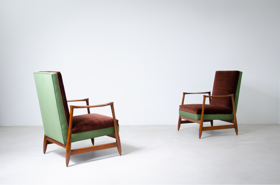 Pair of very elegant armchairs with wooden structure and upholstered fabric.  Italian manufacture, 1960's.