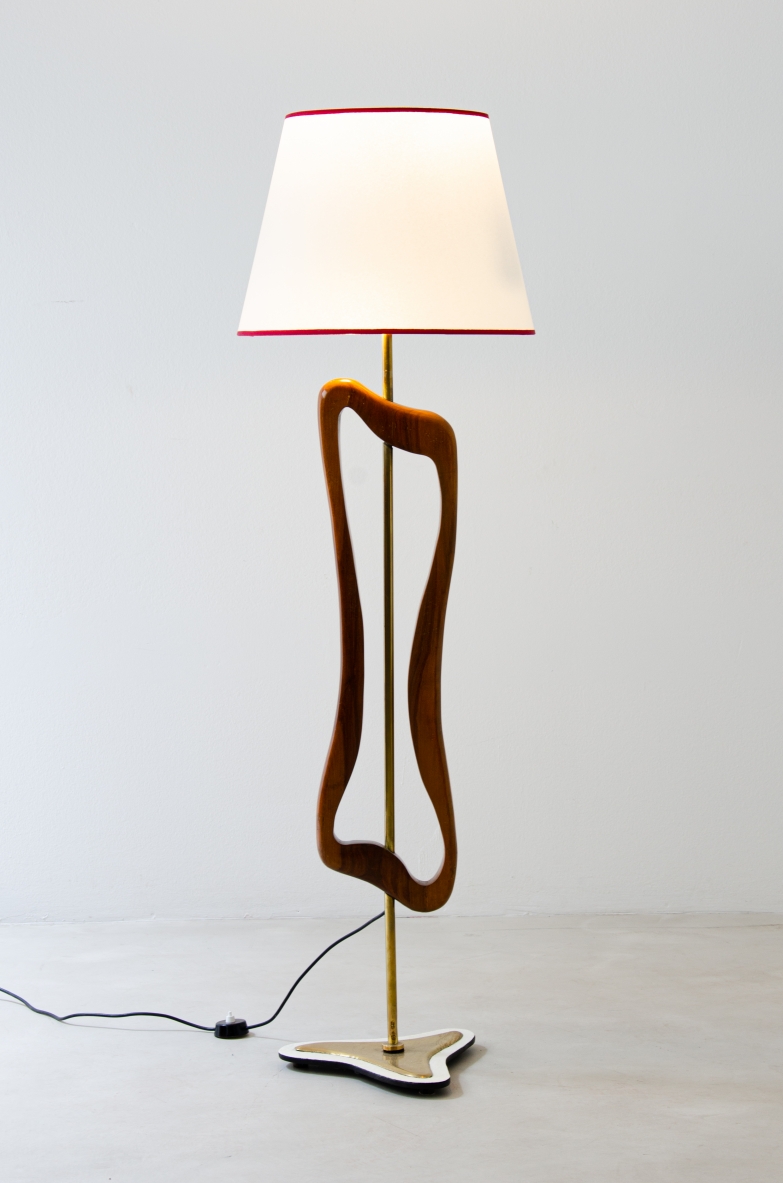 Unique three-light sculptural floor lamp in brass and shaped wood with parchment shade. Italian manufacture, 1950's.