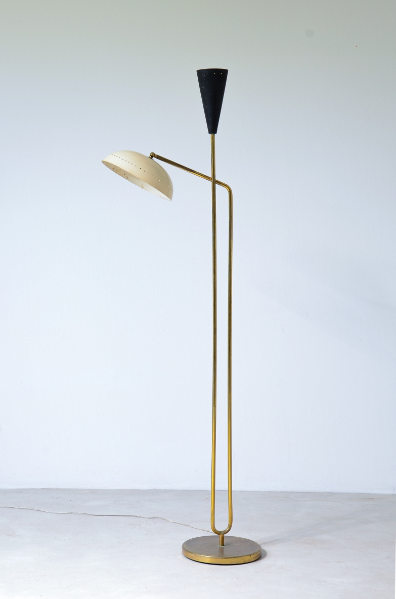 Two light brass floor lamp with cream colored metal shade and black lacquered cone.  Italian manufacture, around 1950.