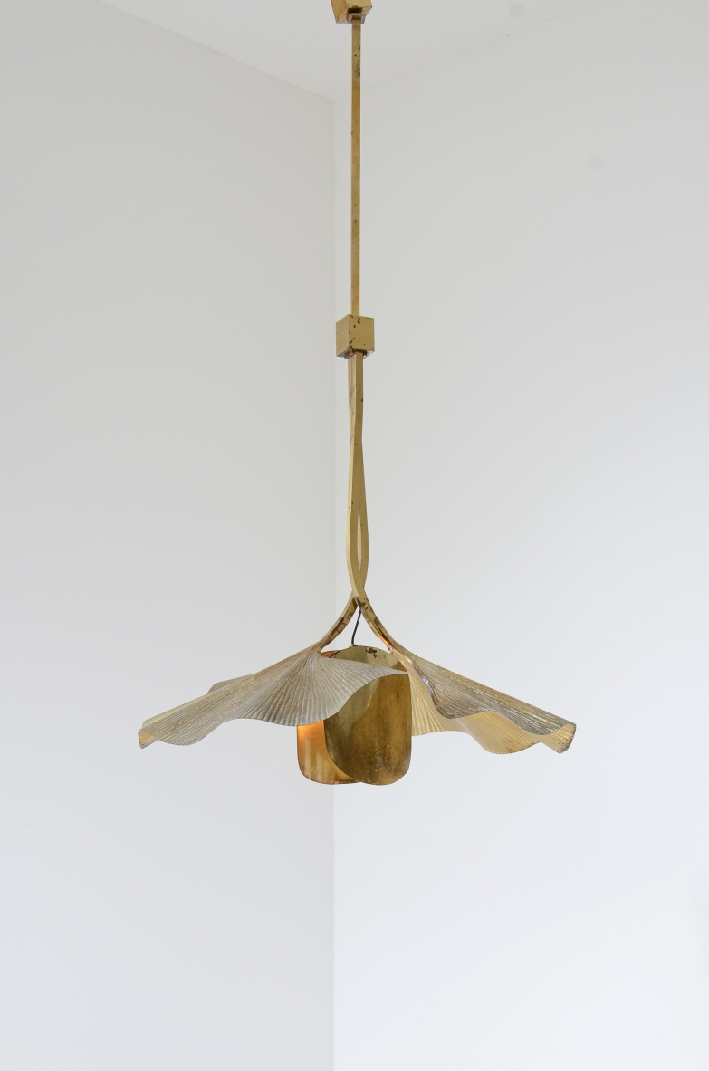 Tommaso Barbi  Large pendant chandelier made by the renowned artist and designer in the shape of a flower composed of 2 large brass ginko leaves and intertwined branches.  Italian manufacture from the 70's
