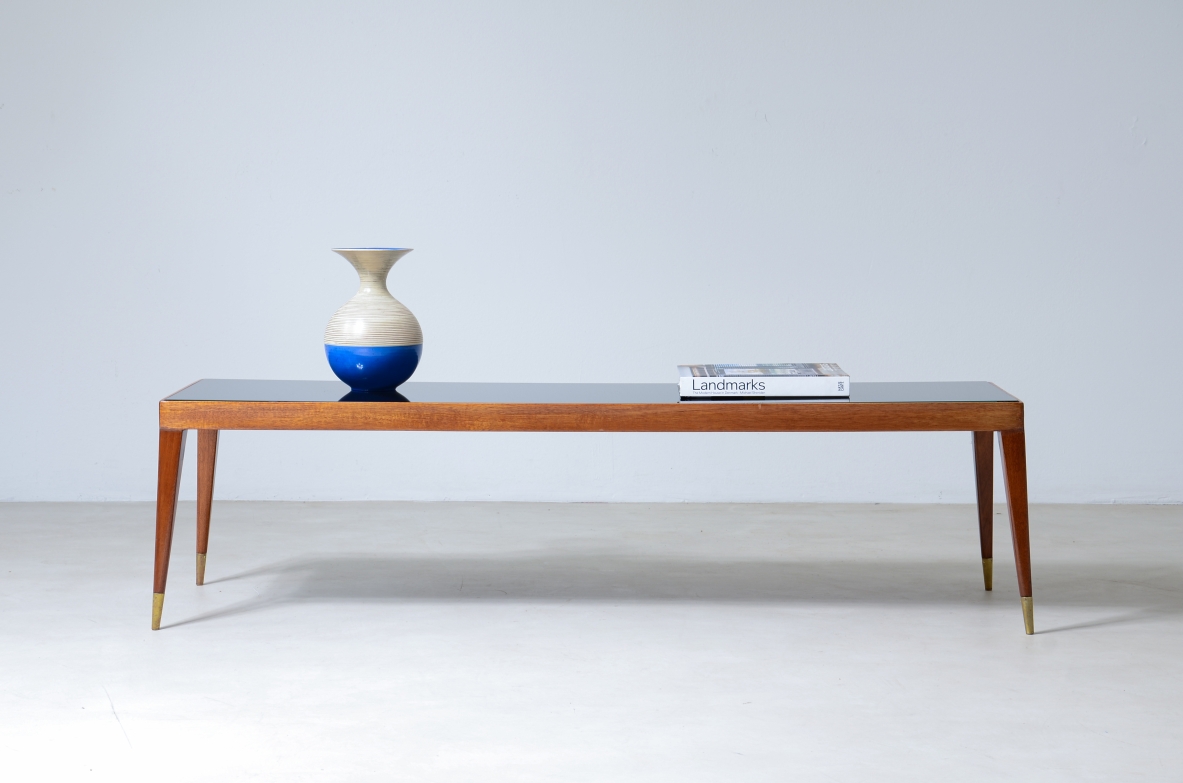 Low table in teak wood and glass top.   Italian manufacture, 1950's