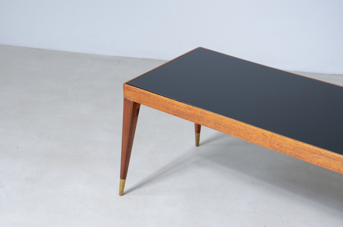 Low table in teak wood and glass top.   Italian manufacture, 1950's