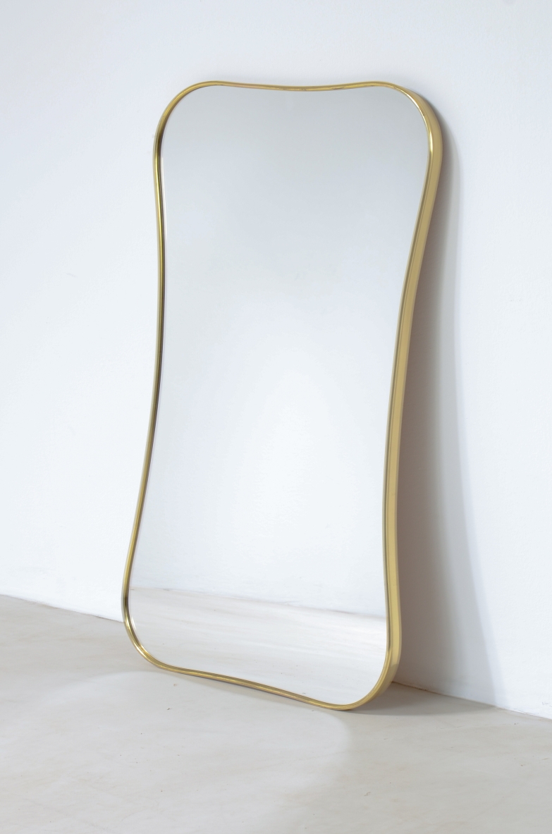 Mirror with shaped brass frame.  Italian 1950s/60s manufacturing.