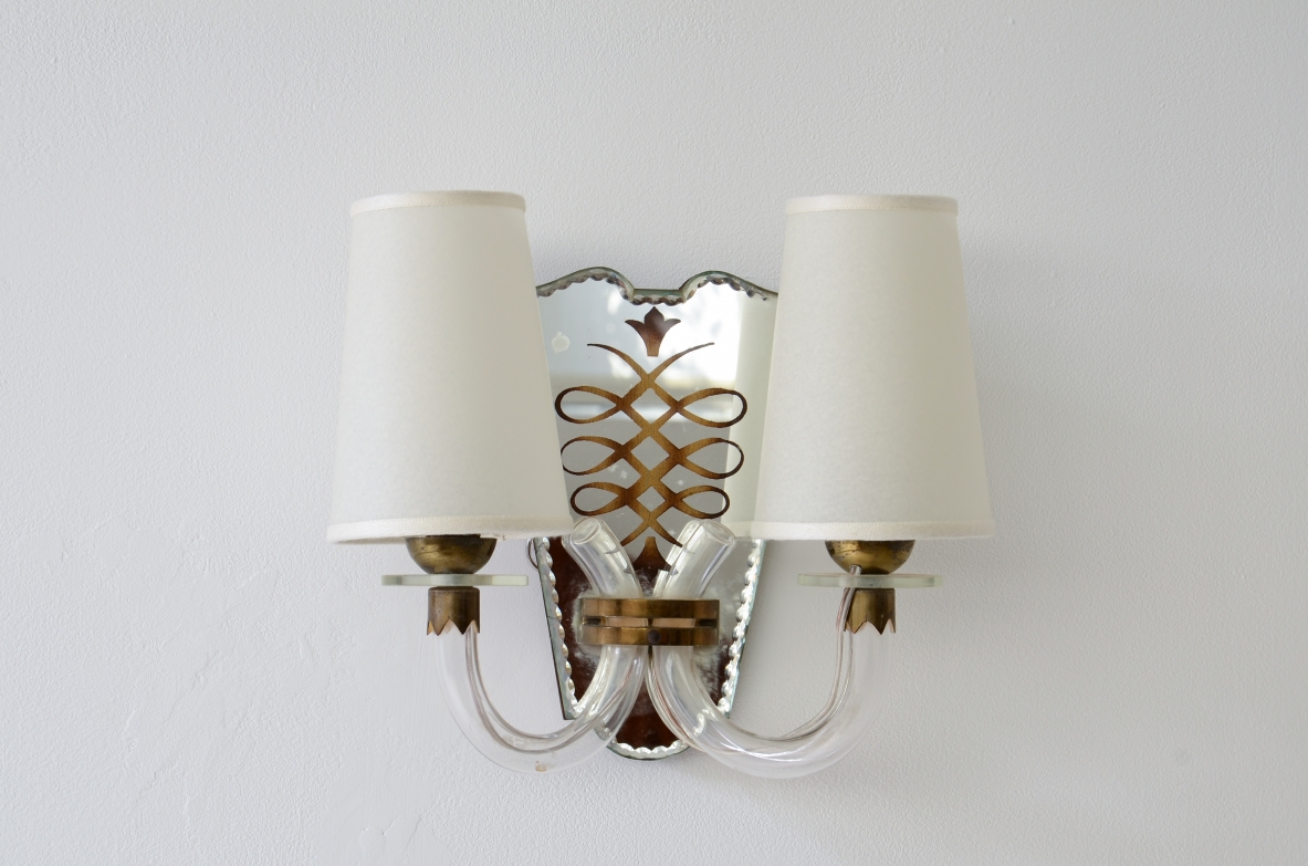 Emilio Lancia  Pair of wall lamps with elegant blown glass arms, shaped fan in engraved and mirrored crystal with brass profile.  1930's manufacture.