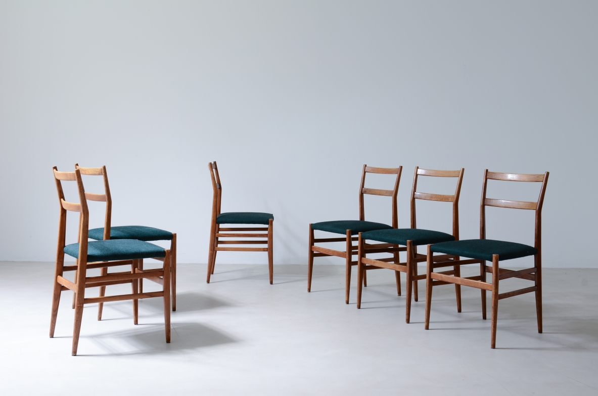 Gio Ponti Set of 8 light model chairs in black stained wood with fabric ...