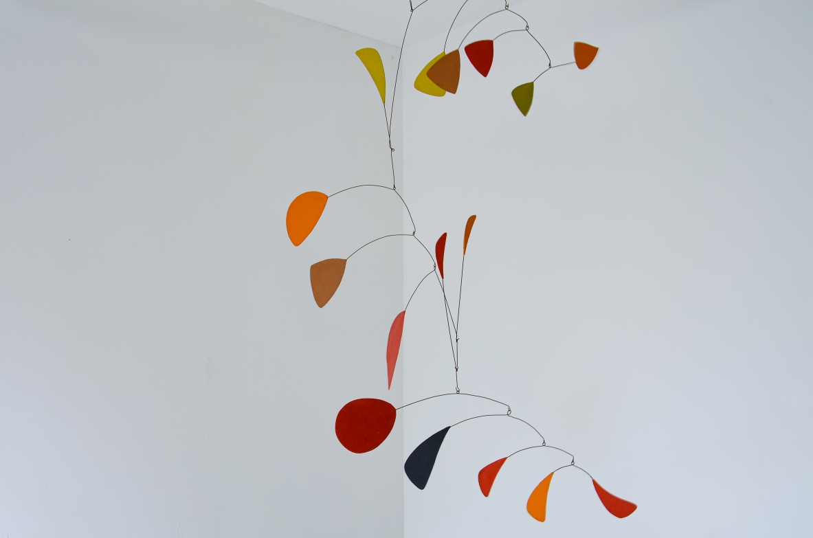 Splendid large kinetic sculpture made up of 15 iron and painted plastic board scales.