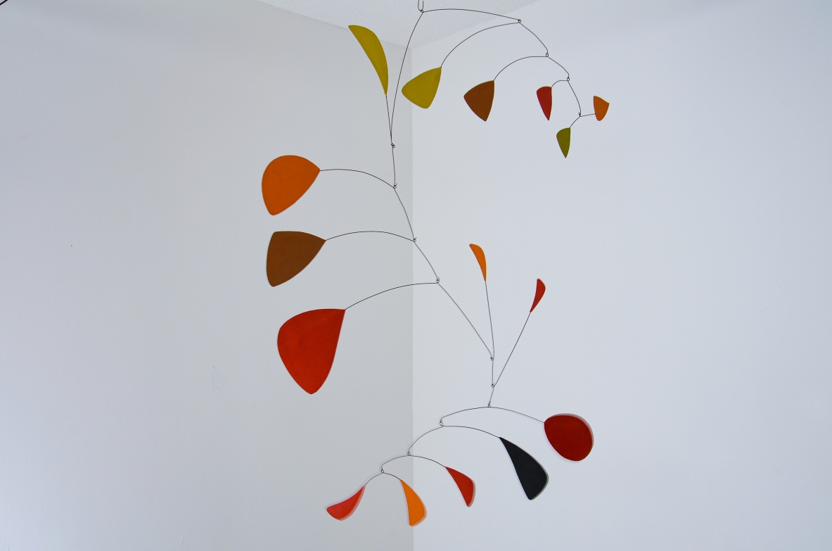 Splendid large kinetic sculpture made up of 15 iron and painted plastic board scales.