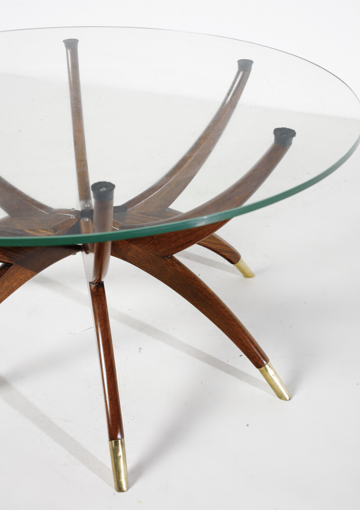 Elegant low table with 6 legs in curved wood with brass tips and cut glass top '50