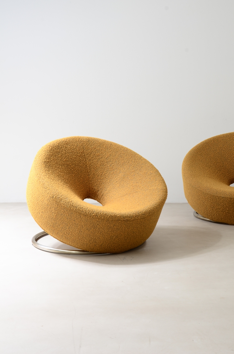 Pair of donut armchairs with steel base and fabric covering.  Italian manufacture from the 70s