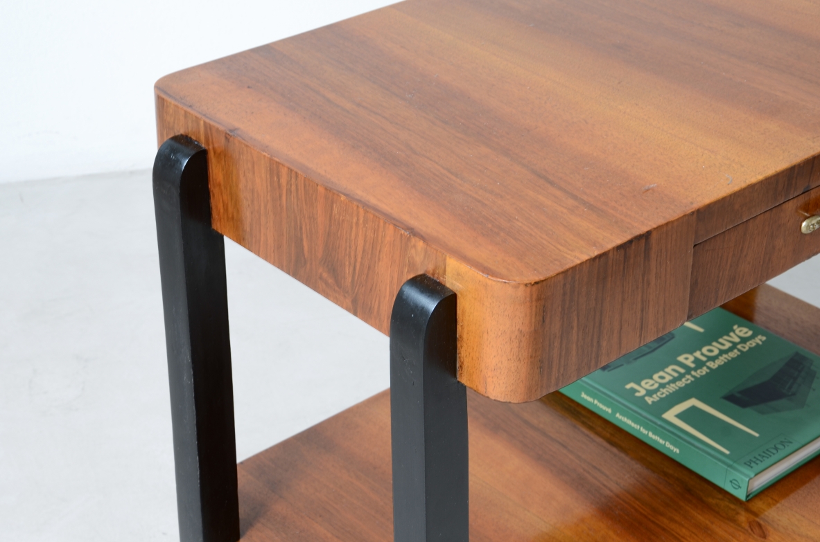 Walnut and stained wood coffee table with two shelves. Made in the 1930s.