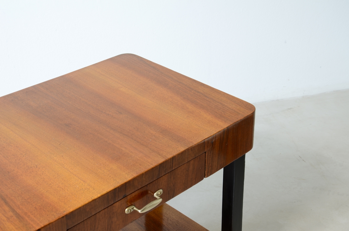 Walnut and stained wood coffee table with two shelves. Made in the 1930s.