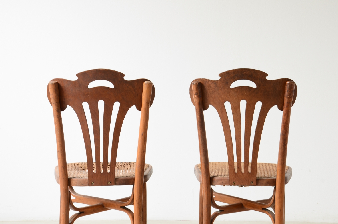 Four bent beech and perforated wood chairs with cane seats.  Thonet manufacture, Austria, circa 1920s.