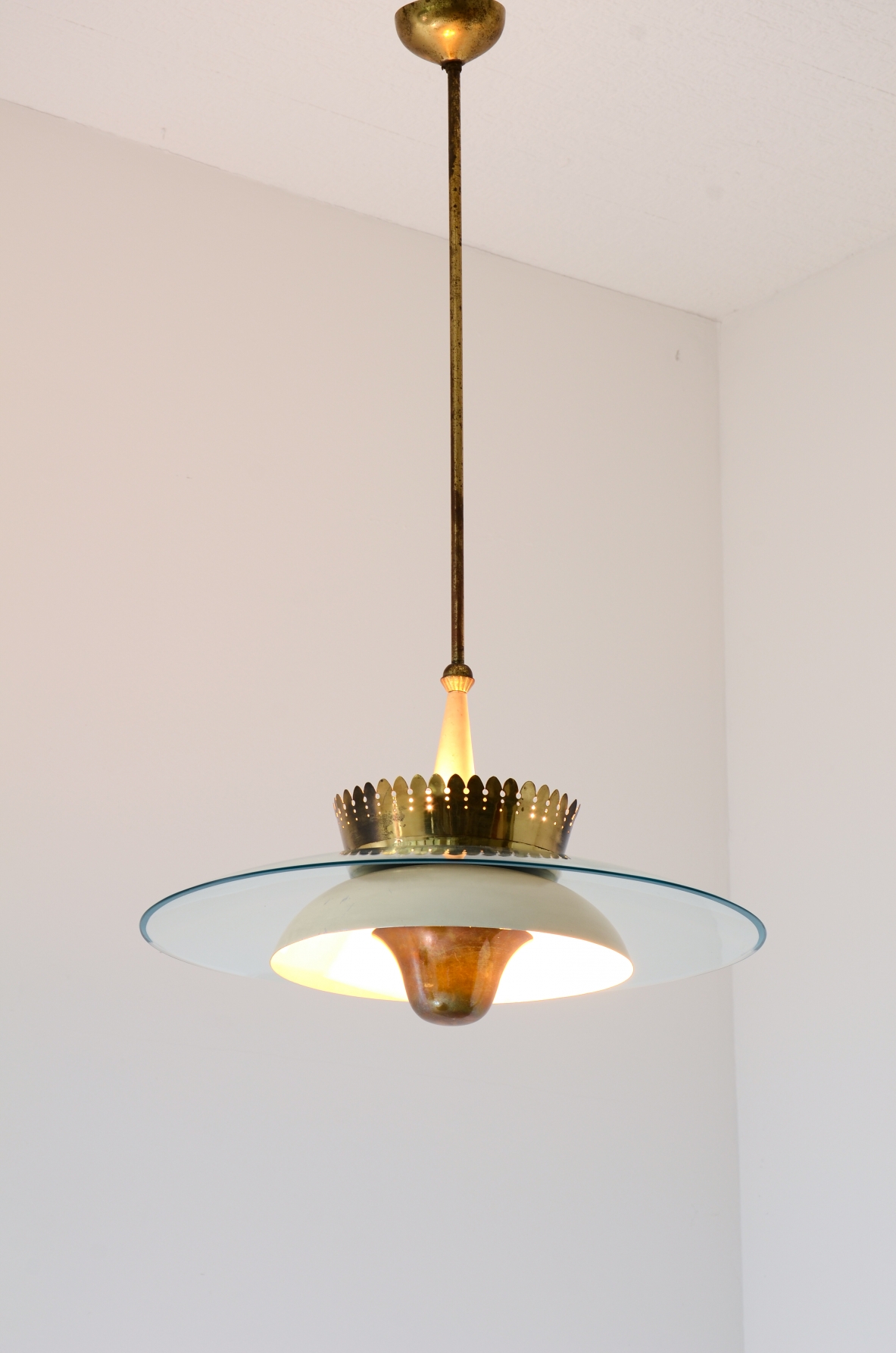 Splendid chandelier with a large curved glass bell and metal bowl 
