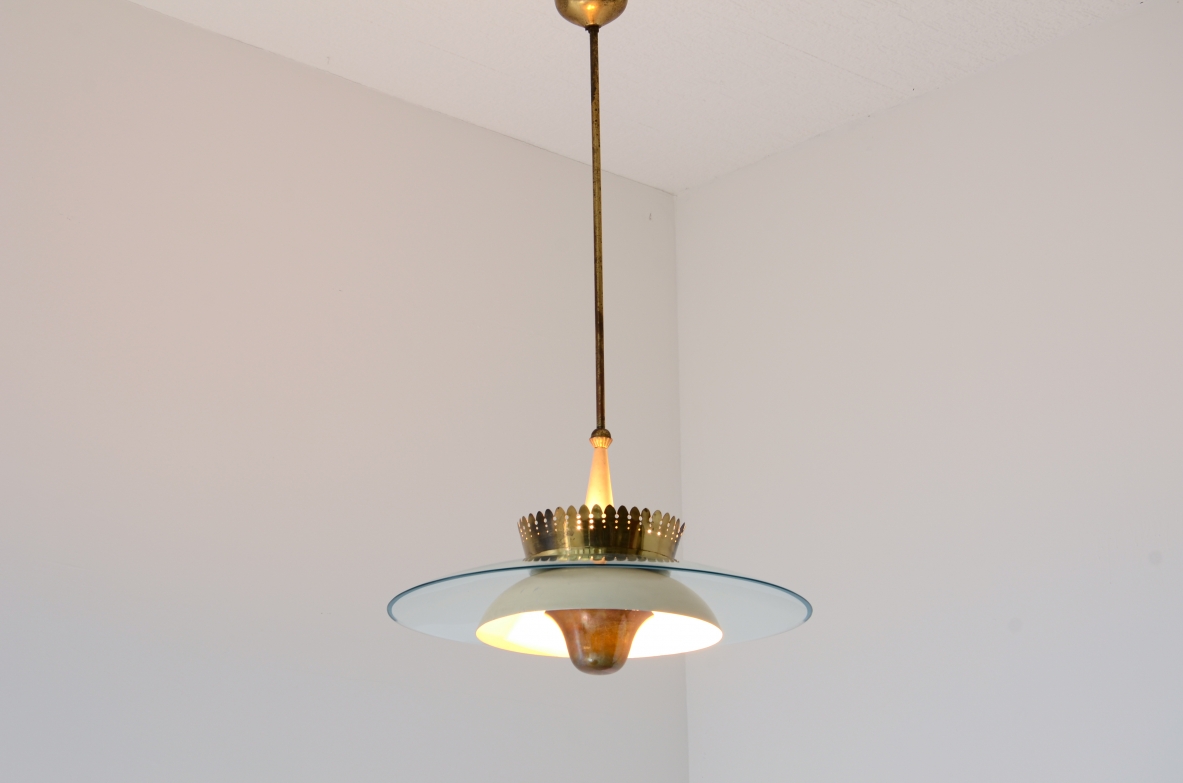 Splendid chandelier with a large curved glass bell and metal bowl 