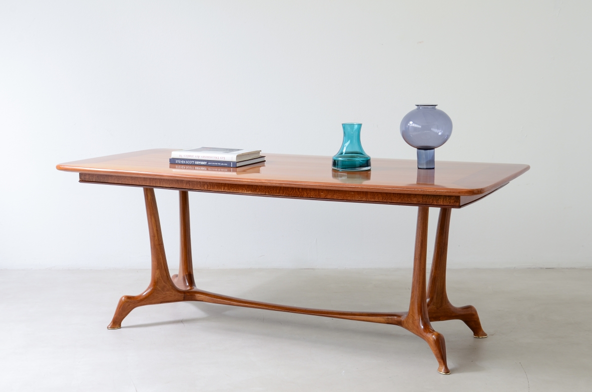 Unique cherry table with a sculptural base featuring taut lines, Made in Italy, circa 1950.