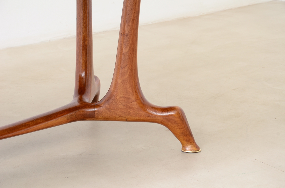 Unique cherry table with a sculptural base featuring taut lines, Made in Italy, circa 1950.