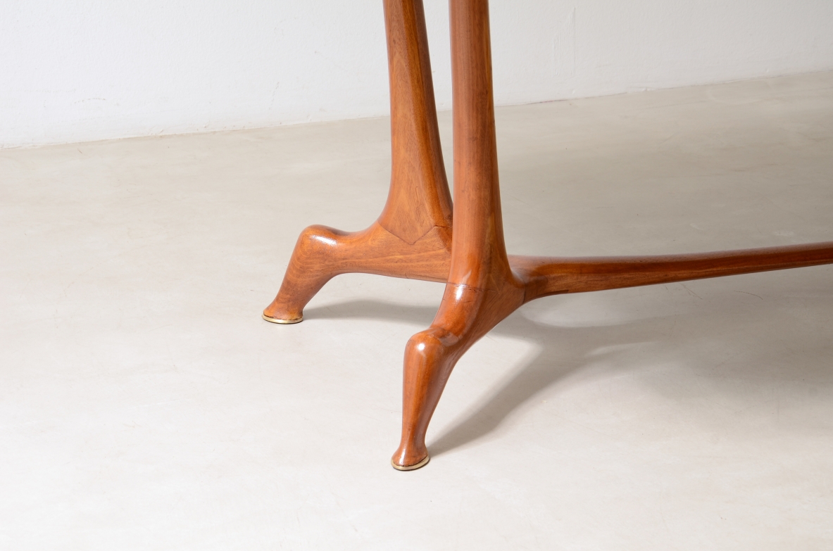 Unique cherry table with a sculptural base featuring taut lines, Made in Italy, circa 1950.
