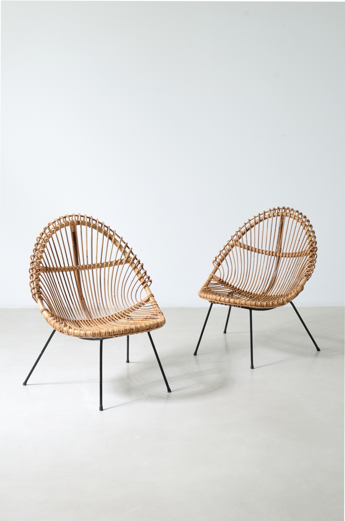 Pair of nice curved rattan chairs with metal legs, Italy1950's.