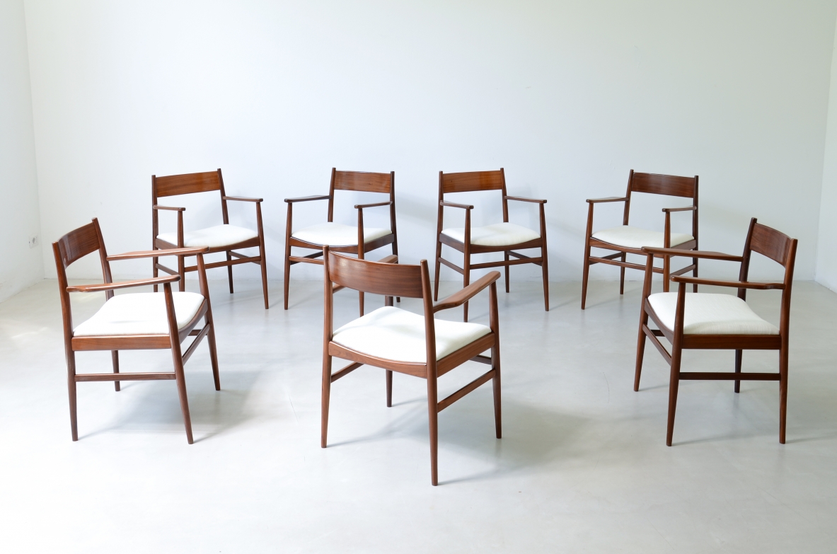 Rare set of 8 armchairs in shaped teak. Manufacture L. Jacobsen, ca. 1960.