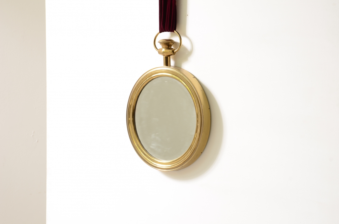 Elegant shaped brass mirror In the style of Piero Fornasetti. 1955