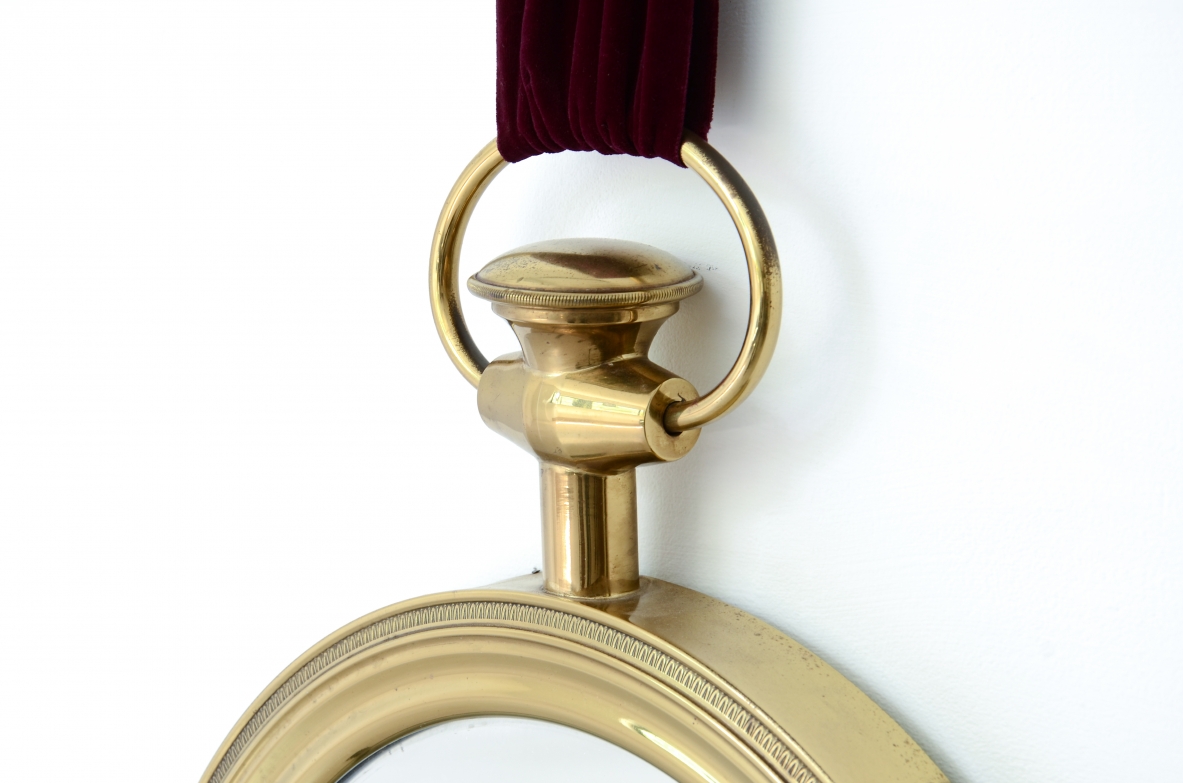 Elegant shaped brass mirror In the style of Piero Fornasetti. 1955