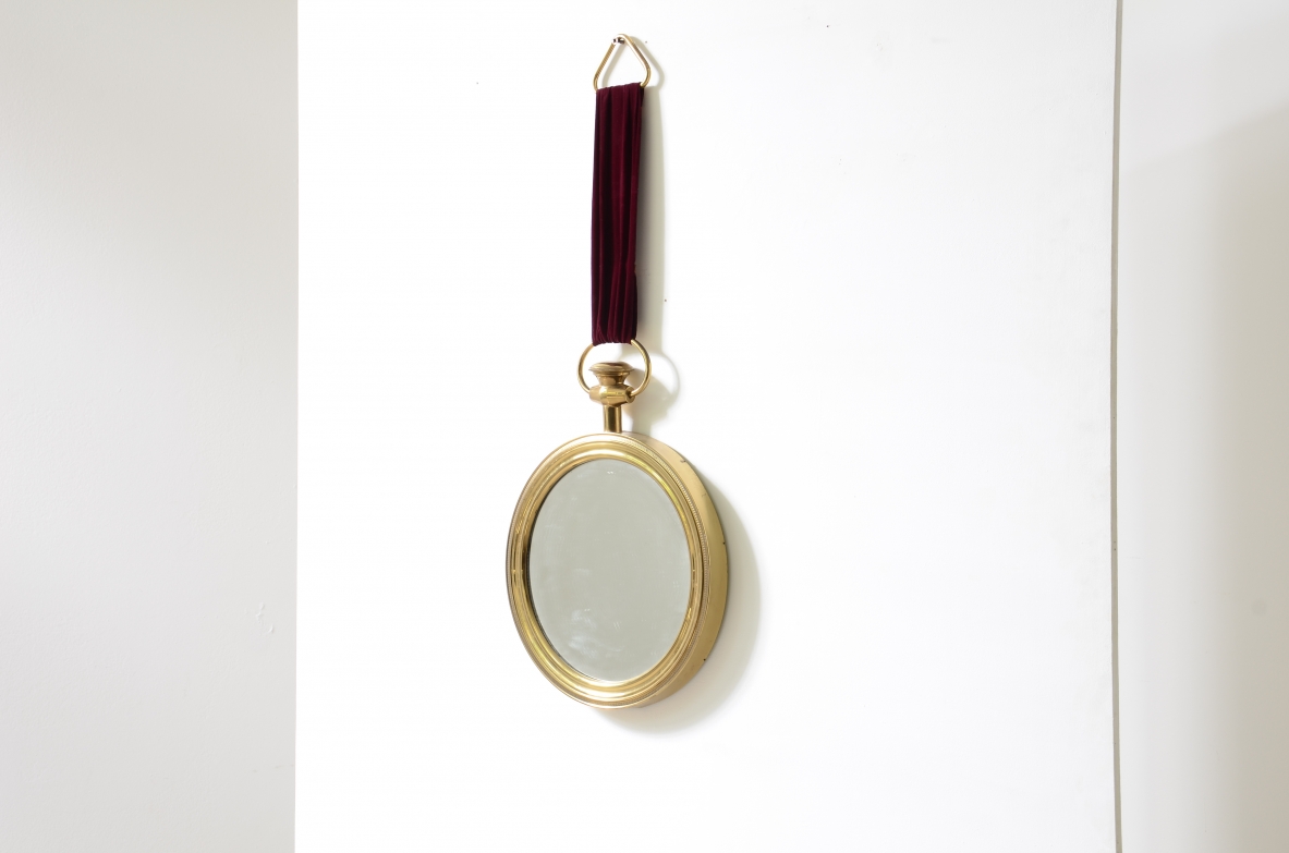 Elegant shaped brass mirror In the style of Piero Fornasetti. 1955