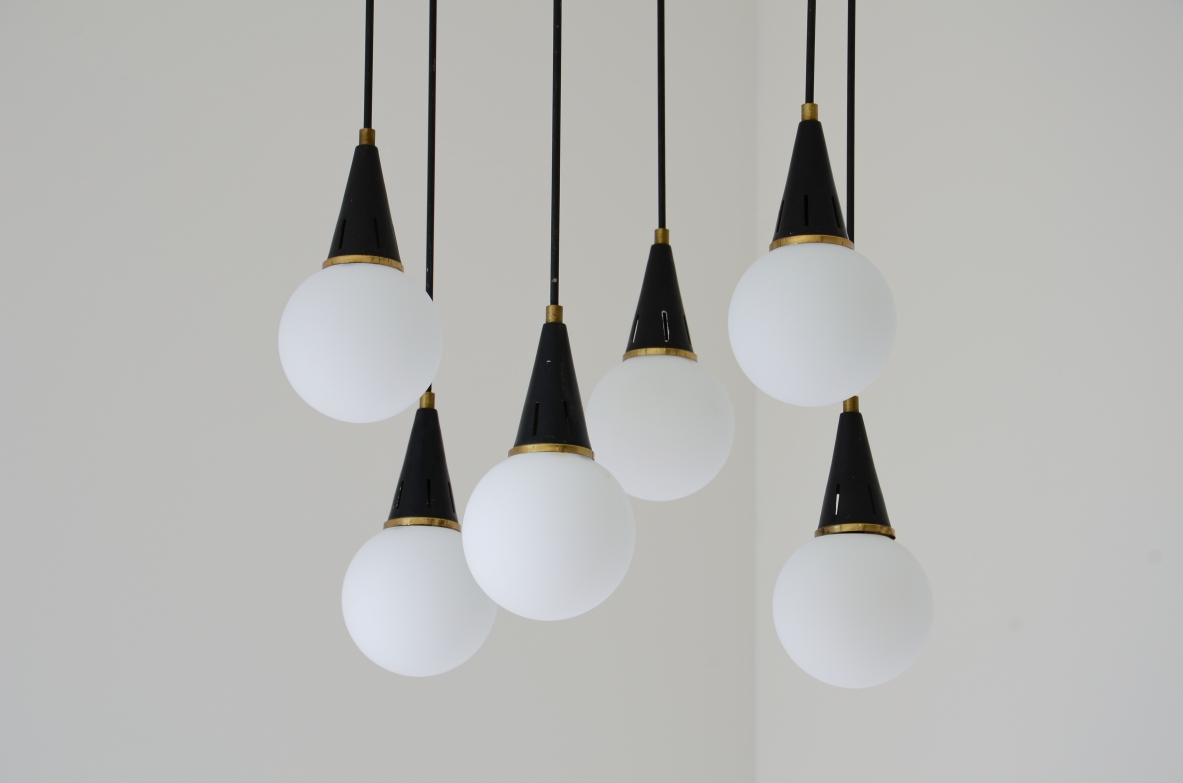 Six-light chandelier with brass arms and opal glass spheres 