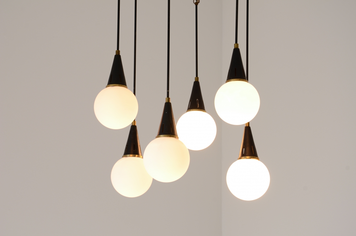 Six-light chandelier with brass arms and opal glass spheres 