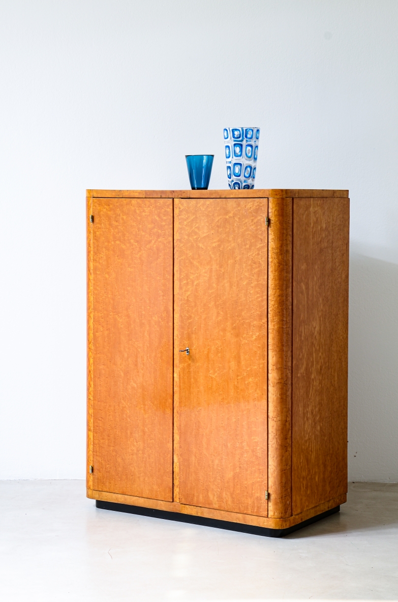 Small French maple burl cabinet circa 1930, featuring shaped doors and drawers.