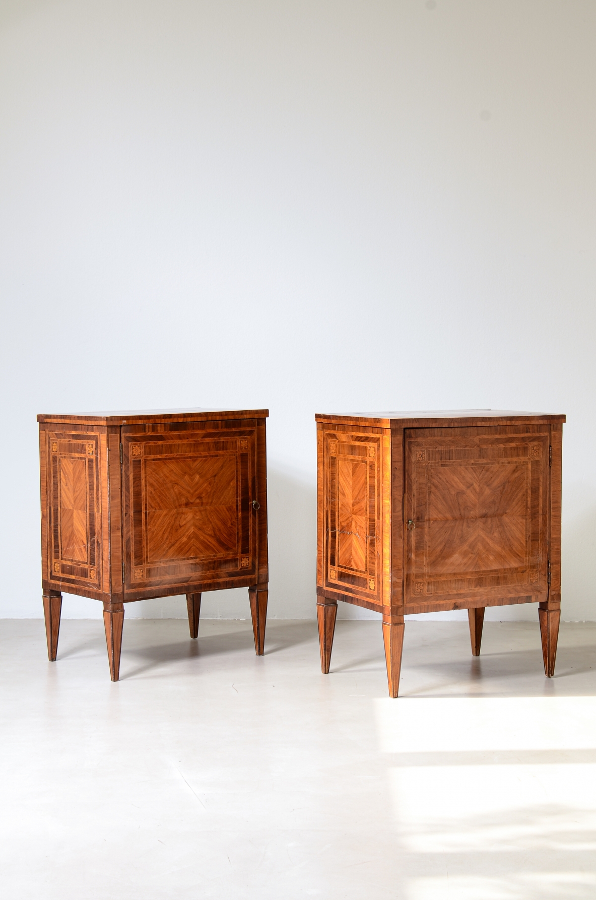 Pair of elegant small cabinets, Italian manufacture, inlaid with fine woods. Louis XVI period, circa 1780–90.