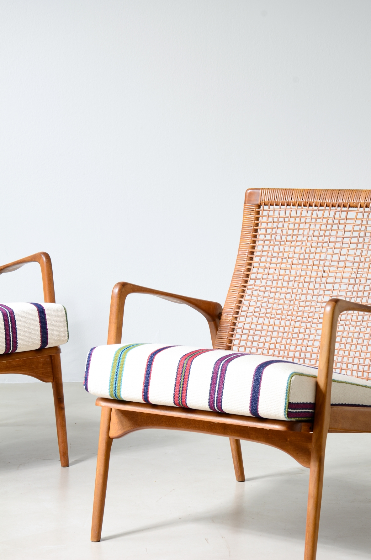 Pair of small armchairs in shaped wood, Scandinavian manufacture, circa 1960.