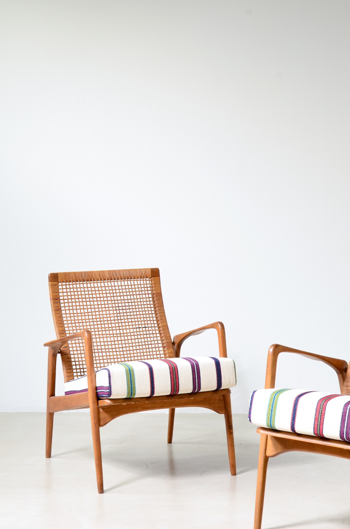 Pair of small armchairs in shaped wood, Scandinavian manufacture, circa 1960.