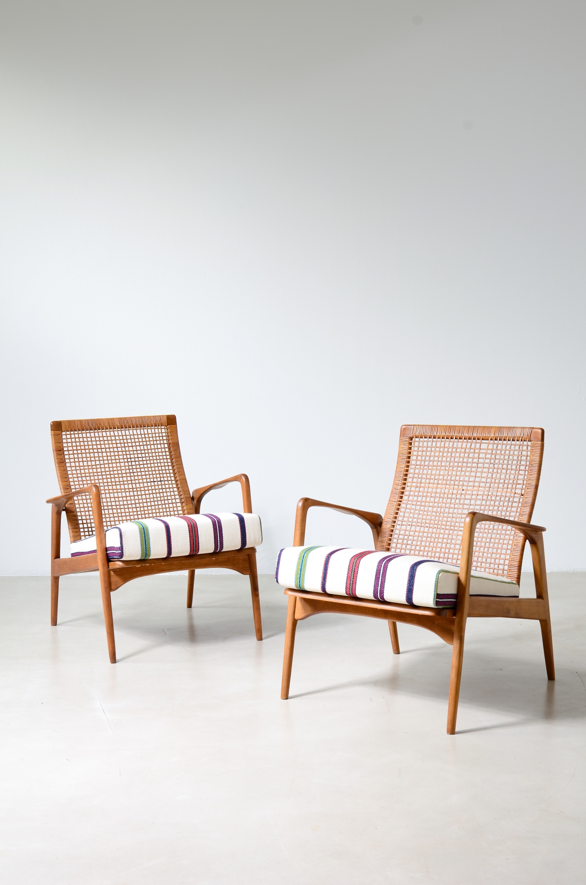 Pair of small armchairs in shaped wood, Scandinavian manufacture, circa 1960.