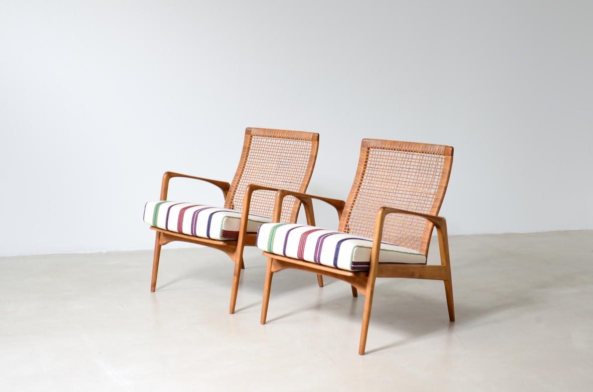 Pair of small armchairs in shaped wood, Scandinavian manufacture, circa 1960.