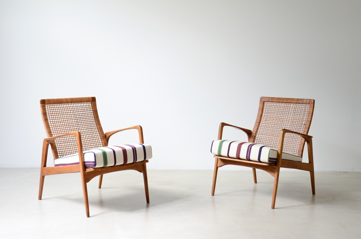 Pair of small armchairs in shaped wood, Scandinavian manufacture, circa 1960.