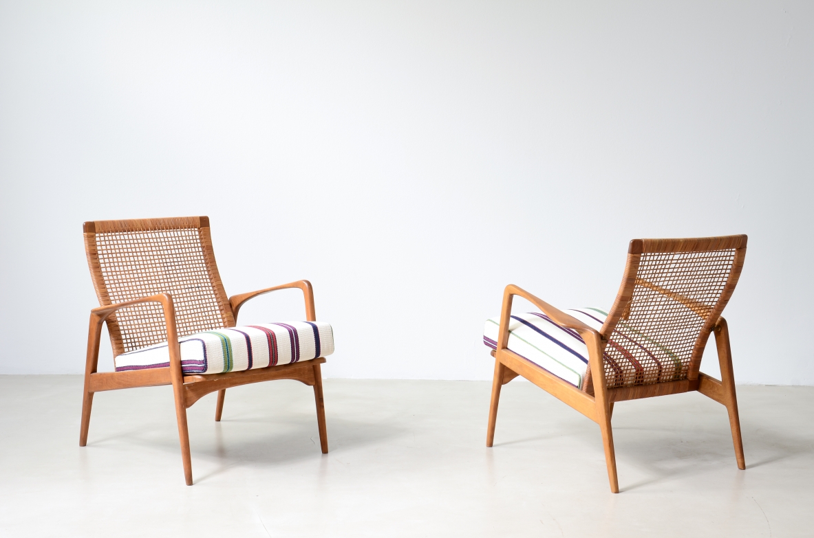 Pair of small armchairs in shaped wood, Scandinavian manufacture, circa 1960.